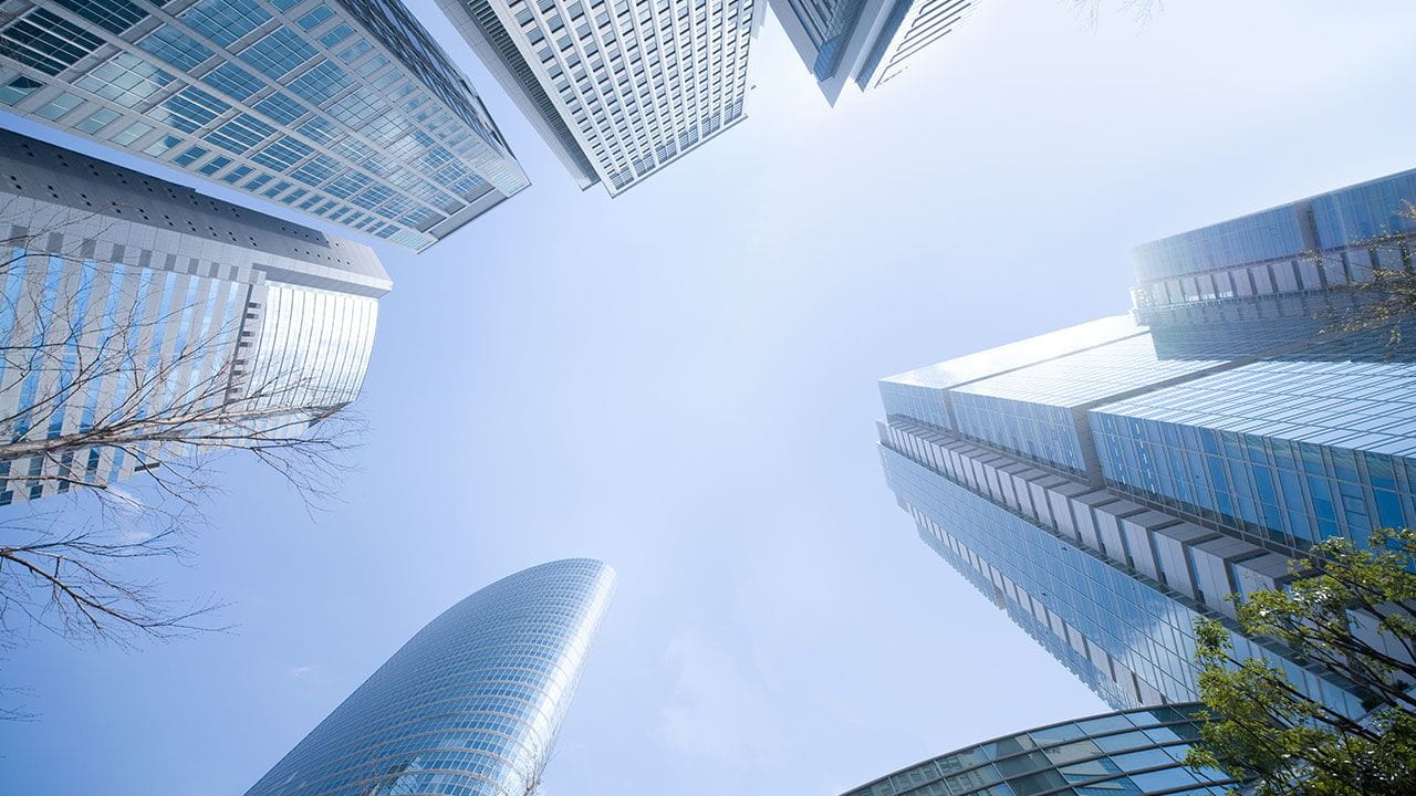 High-rise buildings from below taken looking at the blue sky